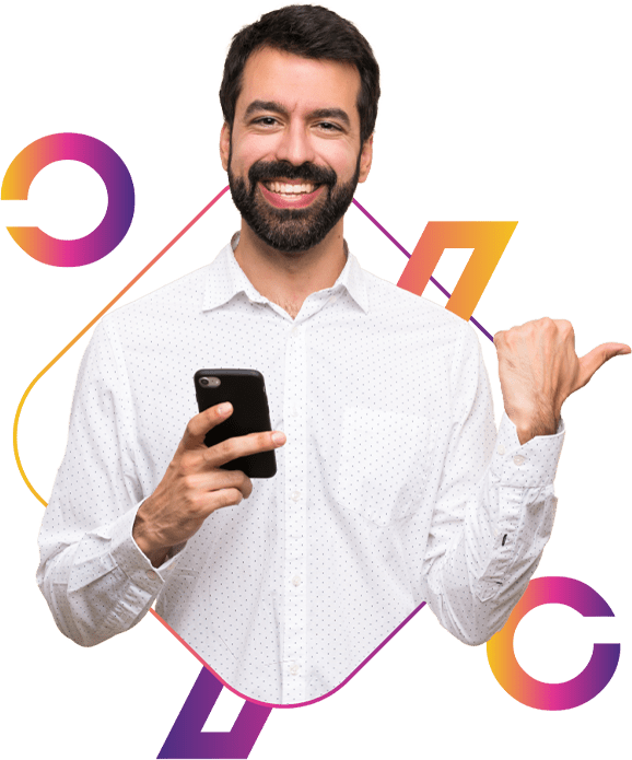Man holding a mobile phone, smiling and pointing to his left with his thumb.